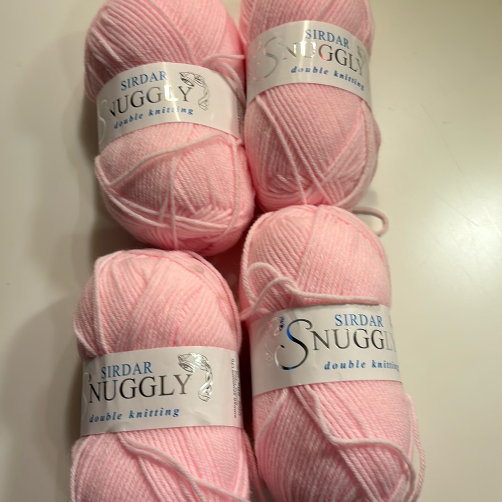 NWT Snuggly DK yarn from Sirdar. Bundle contains 4 50-gm skeins in pink.
